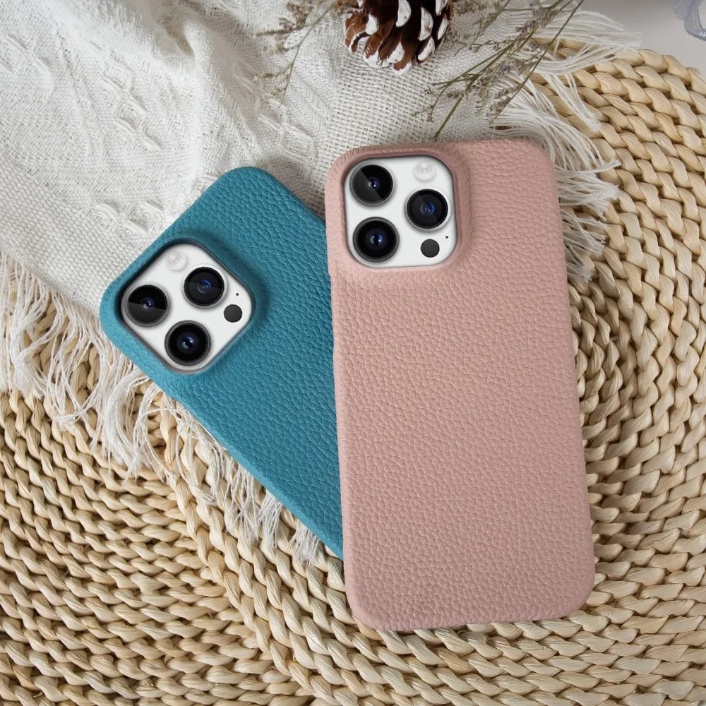 pink leather phone case on top of blue leather phone case