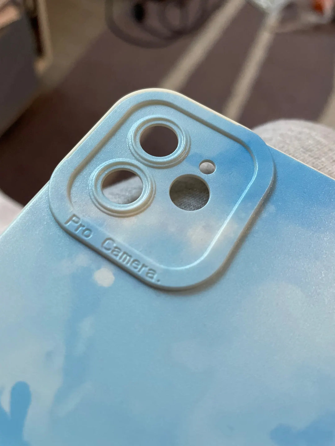 close up of lens area on blue watercolor phone case