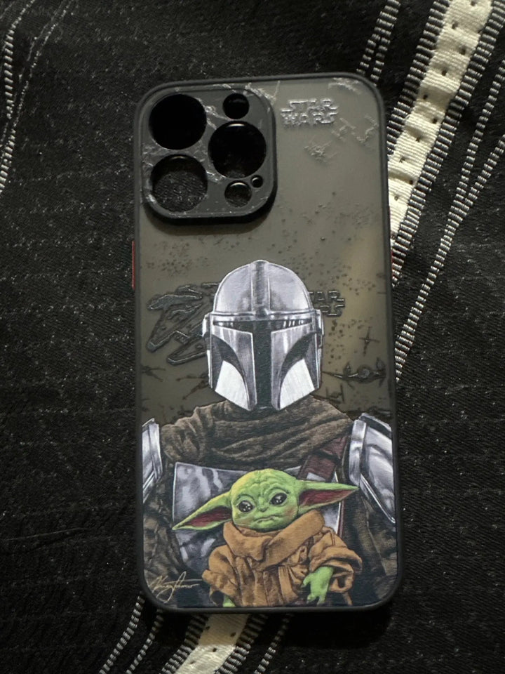 Phone case on a striped fabric background, featuring illustrations of a helmeted character and Baby Yoda from the well-known sci-fi series The Mandalorian, titled Bounty Hunter for iPhone.