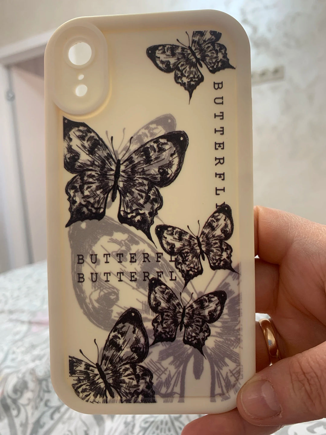 Photo of a white phone case with a butterfly design