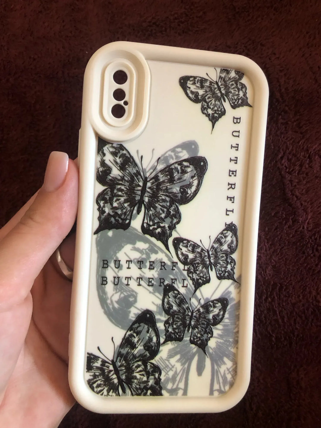 Photo of a white phone case with a butterfly design