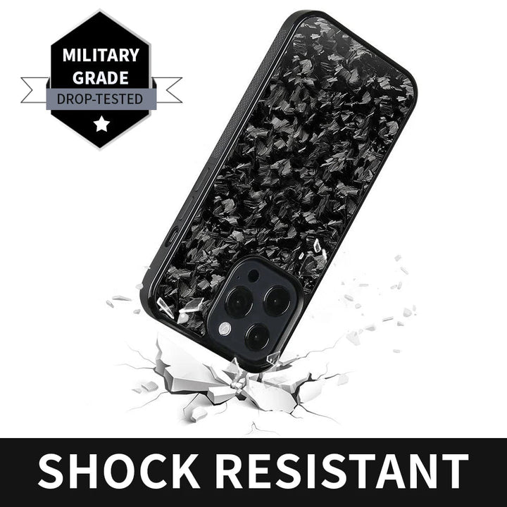 A Carbon Fiber for iPhone encased in a black, textured carbon fiber case is depicted over cracked ground, underscoring its durability. Text reads "MILITARY GRADE DROP-TESTED" and "SHOCK RESISTANT." This iPhone protection combines strength and style seamlessly.