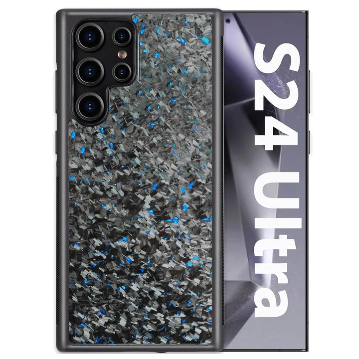 Close-up of a phone case with a multicolored, abstract design featuring blue and silver flecks next to a box with the text "S24 Ultra" on it. This Carbon Fiber for Samsung device accessory boasts ultimate protection with its textured, glittery appearance.