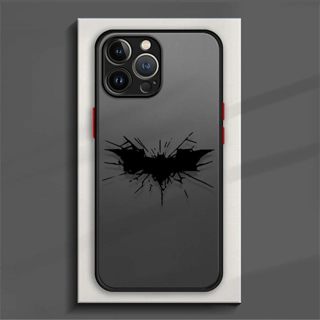 Phone case featuring a cracked Batman symbol