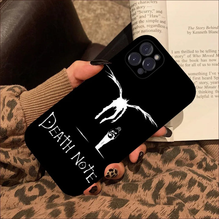 A black phone case showcasing the Death Note title along with Light and Ryuk walking