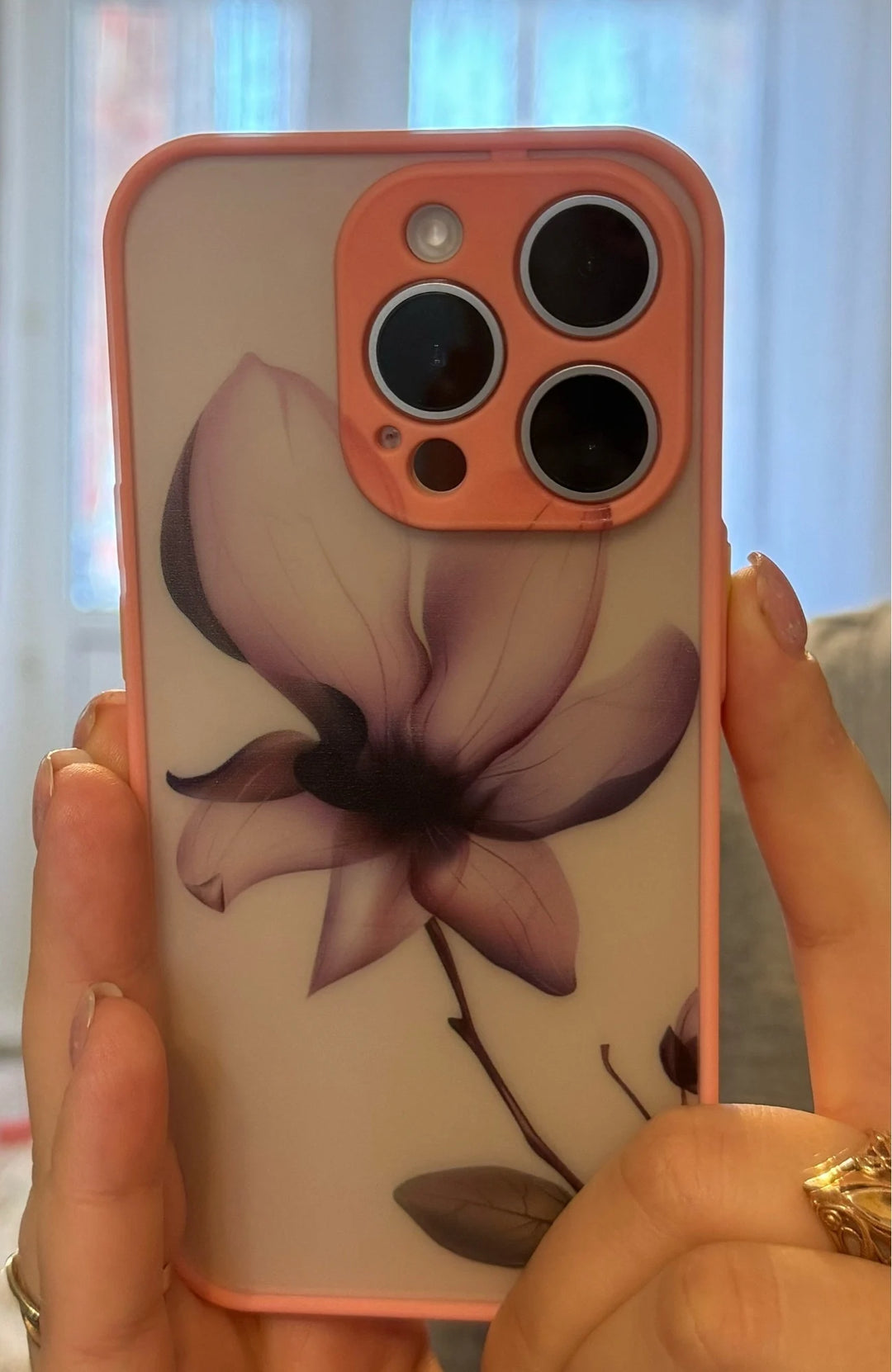 Phone case with flowers depicted in a watercolor style