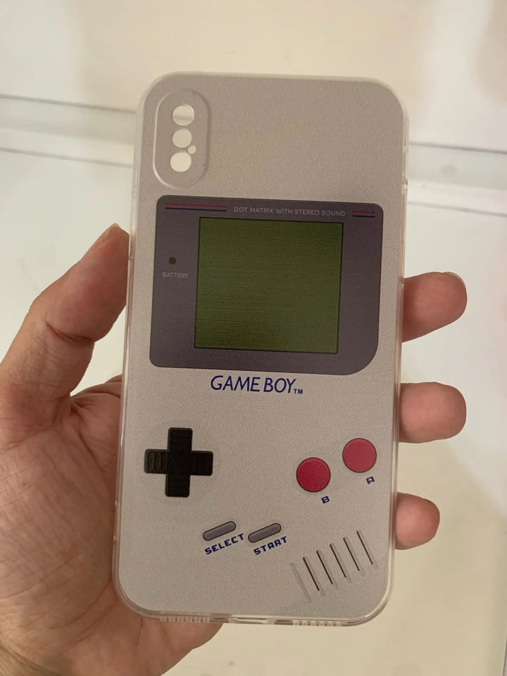 A hand holds the "Gameboy Case For iPhone," designed to resemble a vintage Game Boy, perfect for retro gaming enthusiasts, featuring buttons, a directional pad, and an anti-scratch screen layout.