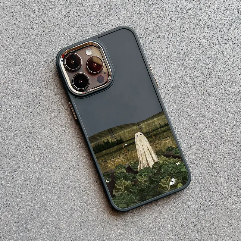 A black phone case with a white ghost standing in a field of green plants.