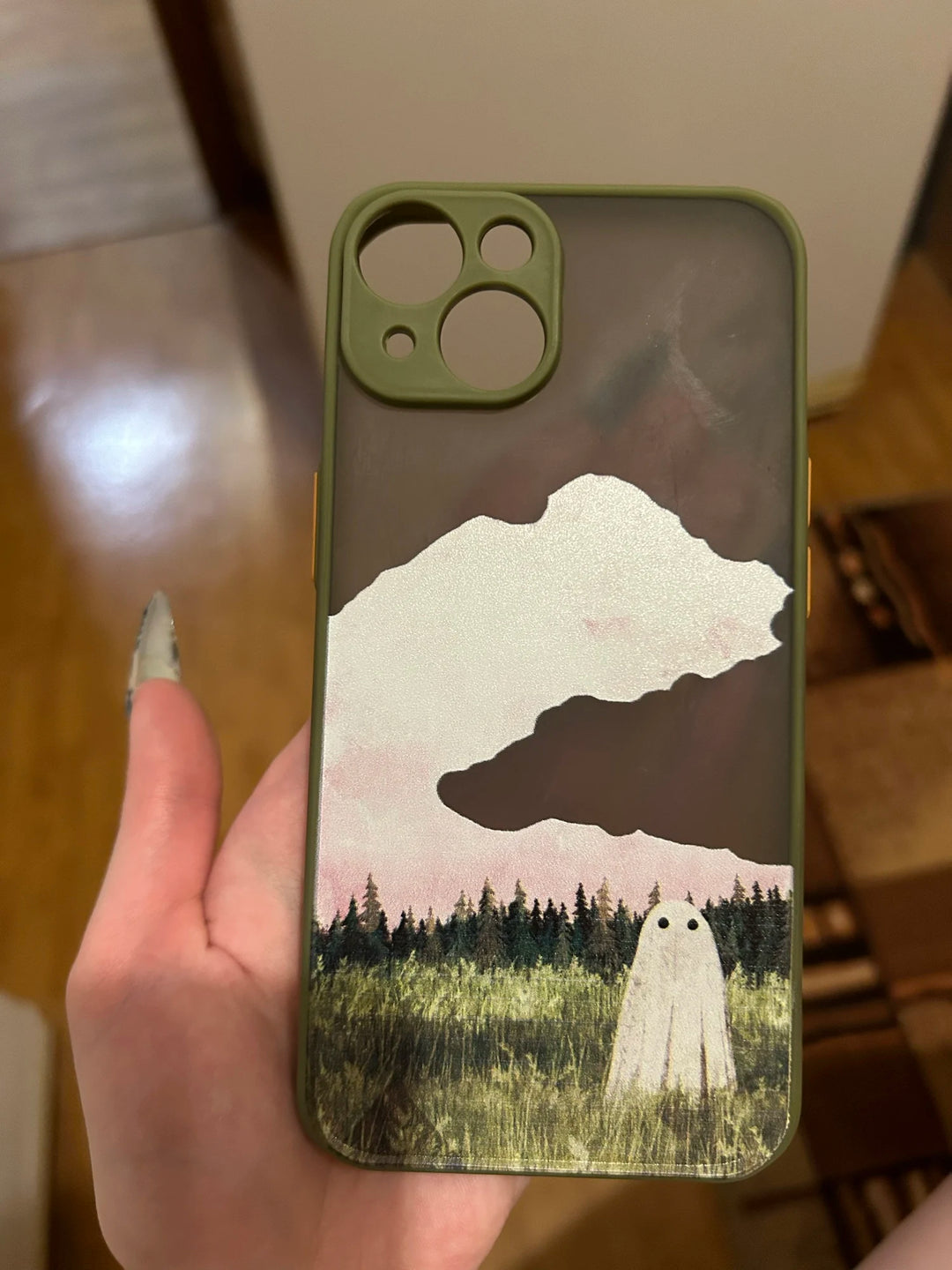 Phone case of cute ghost in green field