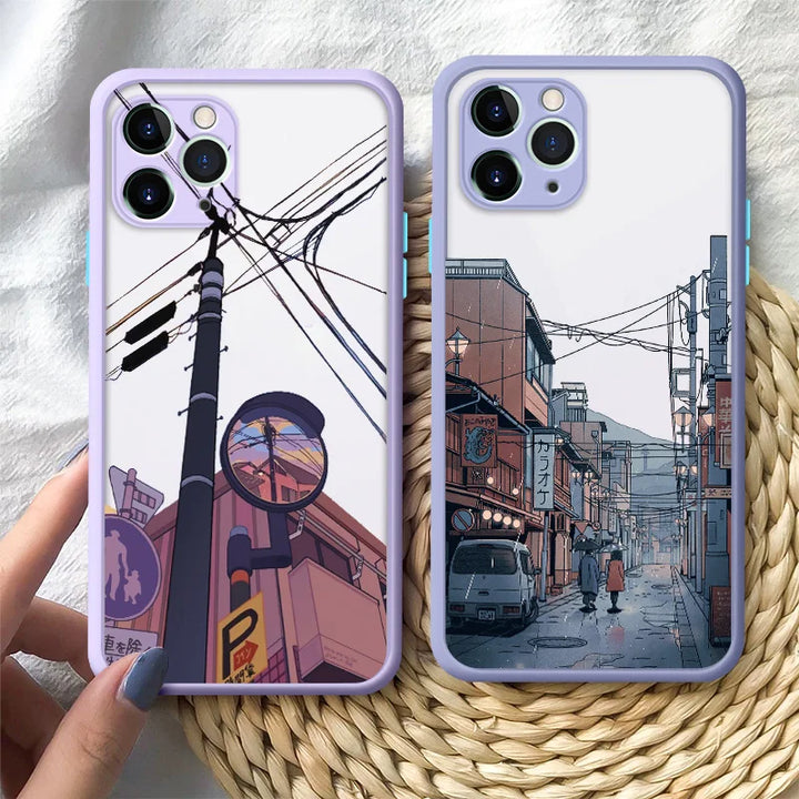 Two purple colored phone cases featuring designs inspired by Japanese landscape