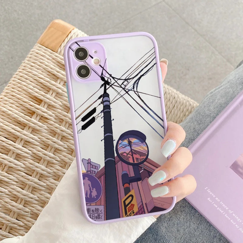 A purple phone case with a frosted back showing a low-angle shot of a street corner in a city