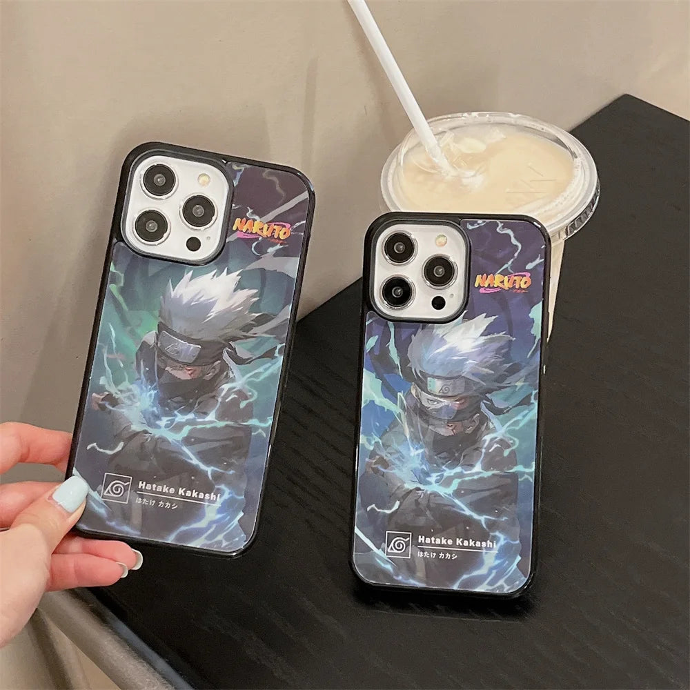 Two smartphones with Naruto-themed anti-scratch phone cases featuring the Kakashi Angle Art next to a cup with a straw on a table.