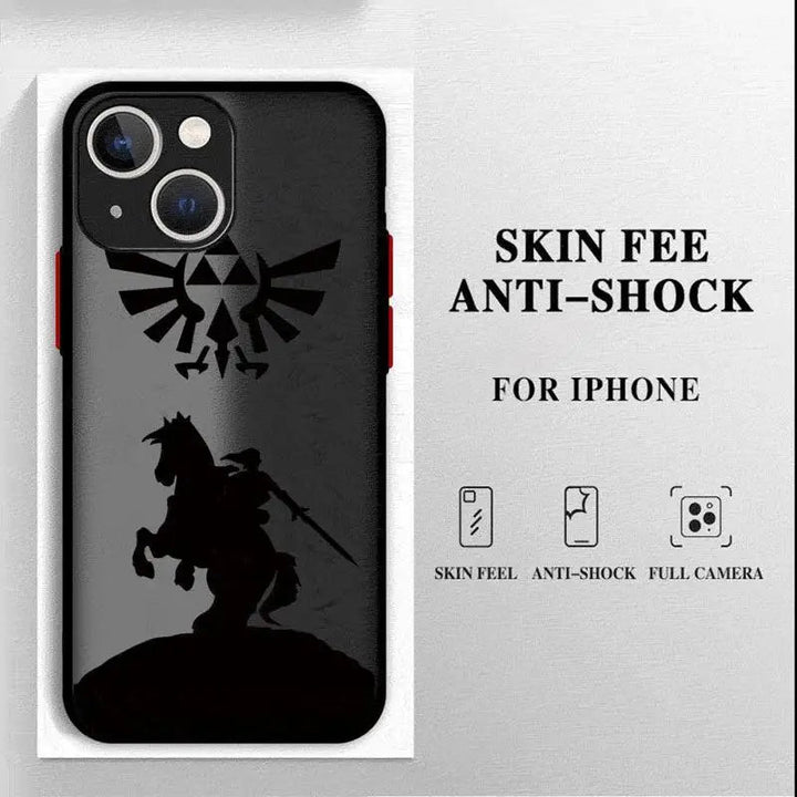 A protective iPhone case titled "Legend of Zelda for iPhone" showcases a striking silhouette design of a sword-wielding warrior on horseback, evoking the iconic Master Sword from the Legend of Zelda series. The design is complemented by a winged emblem adorned with a triangle pattern above it. Text on the right side states, "Skin Feel Anti-Shock for iPhone," accompanied by icons signifying skin feel, anti-shock properties, and full camera protection.