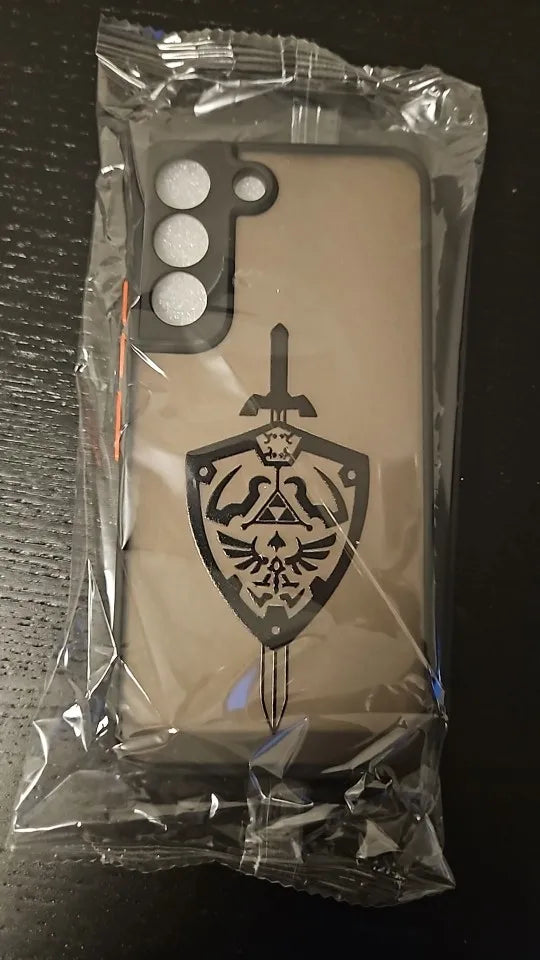 Legend of Zelda for Samsung, featuring a sword and shield emblem, packaged in a clear plastic bag.