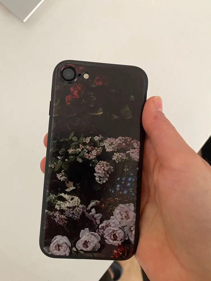 Phone case in hand of Monet's Spring Flowers