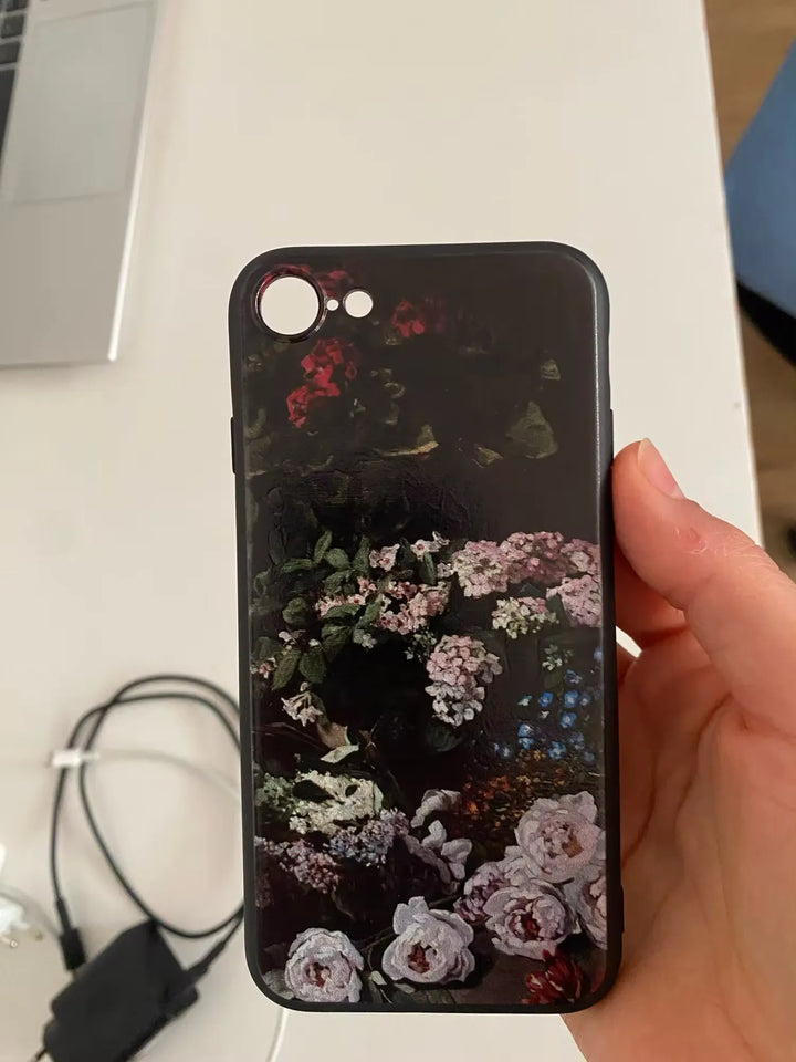 Phone case in hand of Monet's Spring Flowers