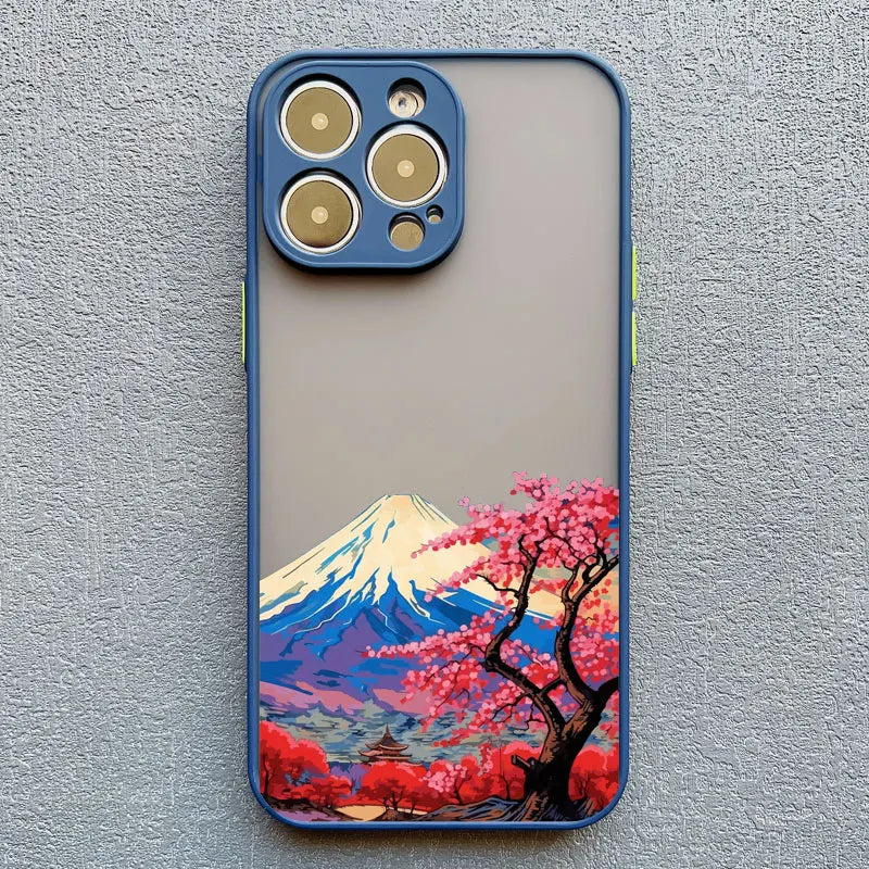 A blue phone case with a clear back featuring a Japanese landscape with Mount Fuji, cherry blossoms, and a temple