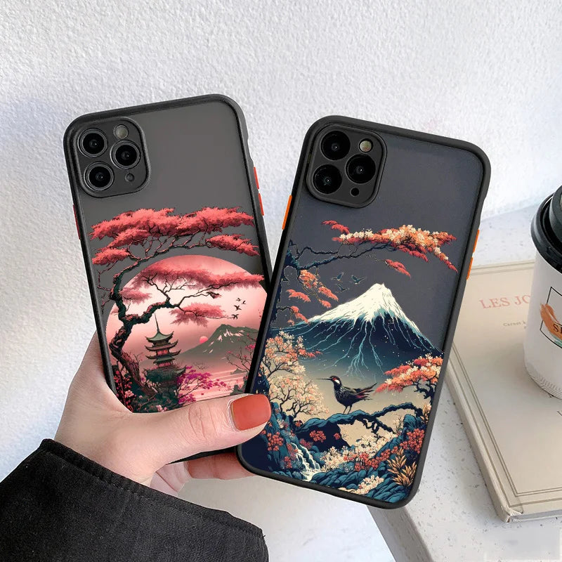 Two iPhone cases featuring nature designs with Mount Fuji in the background