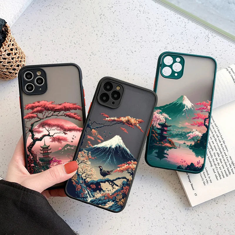 Three iPhone cases featuring nature designs with Mount Fuji in the background