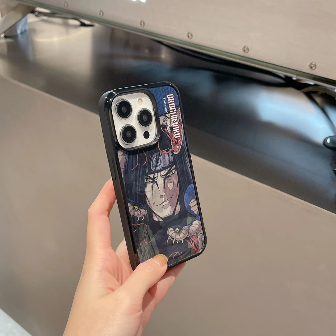 A person holds an iPhone with a Magsafe compatible case featuring the Orochimaru Angle Art, showcasing an illustrated character with dark hair and red eyes, accompanied by small illustrated snakes. The case has a striking 3D effect that brings the design to life.