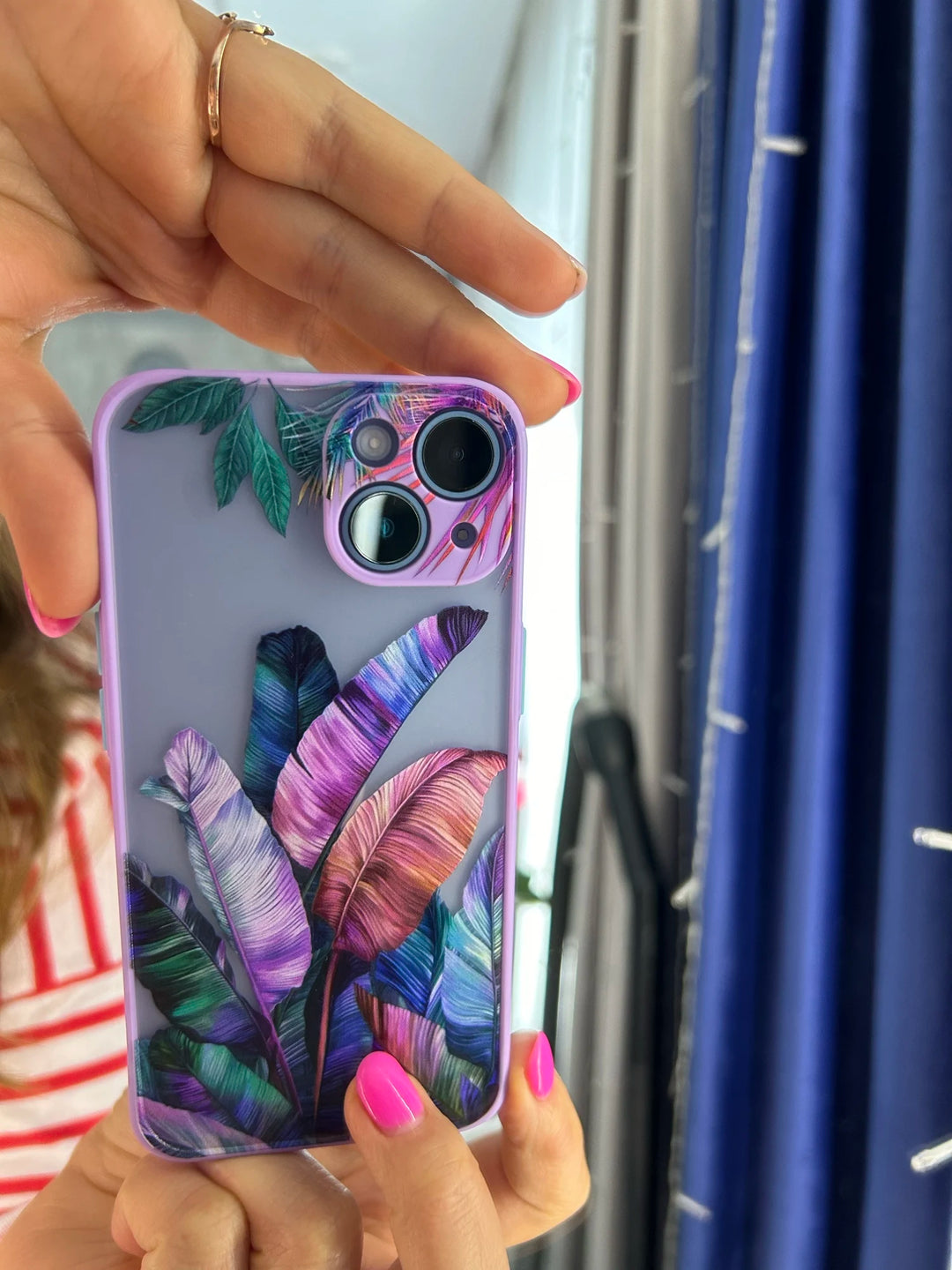 Photo of frosted phone case with a vibrant tropical leaf design