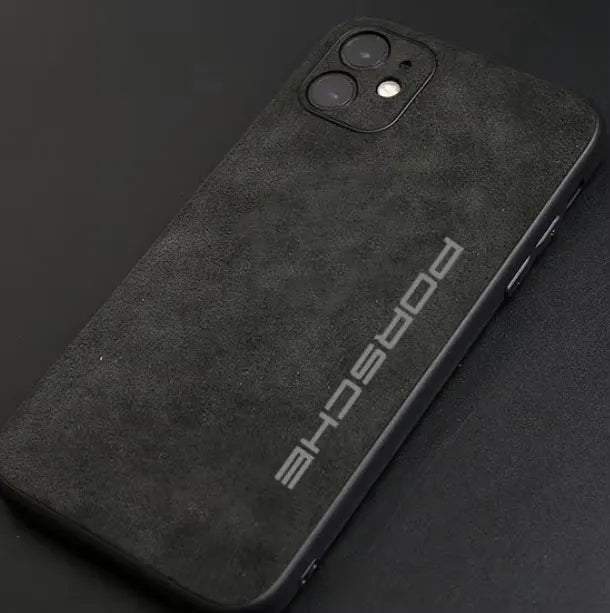 A sleek Porsche for iPhone encased in a slim black design, featuring the Porsche logo in elegant gray lettering on its back.