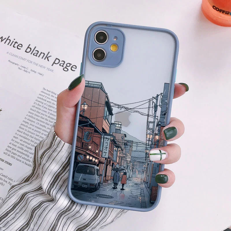 A blue phone case with a frosted back featuring a Japanese cityscape in the rain