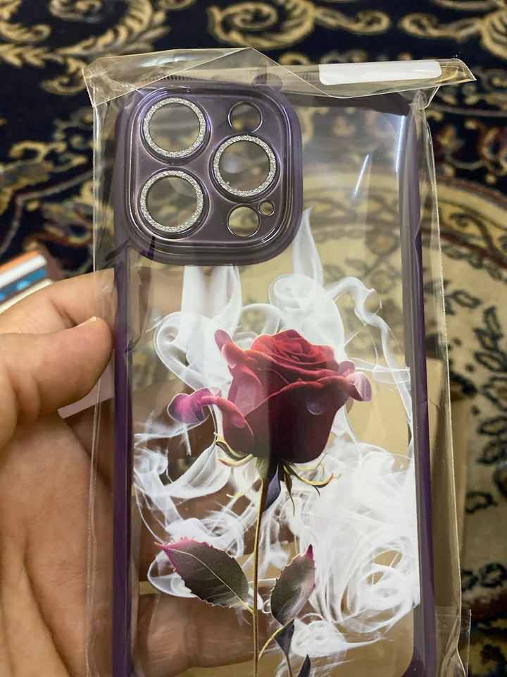 A phone case with a clear, transparent back featuring a vibrant rose design