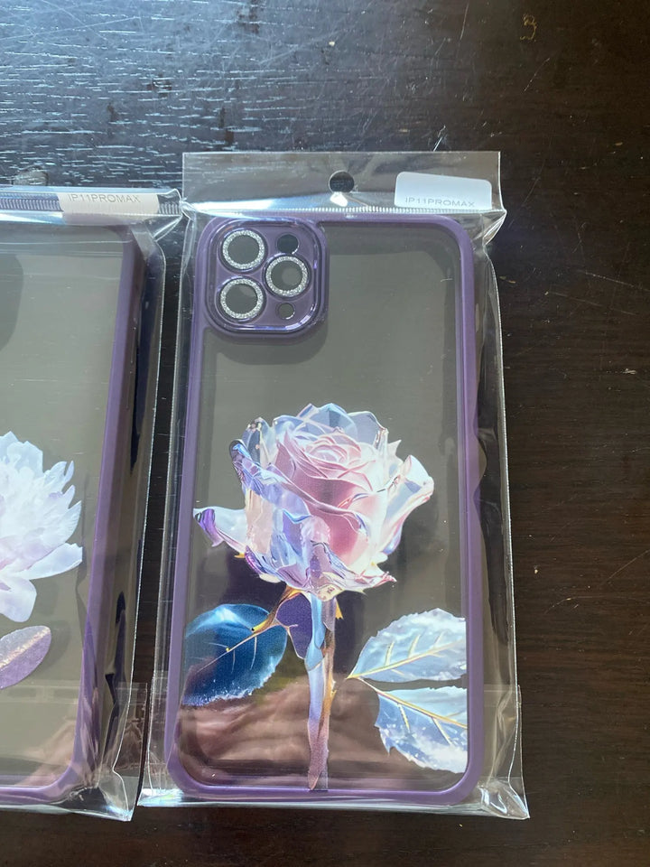 A phone case with a clear, transparent back featuring a vibrant rose design