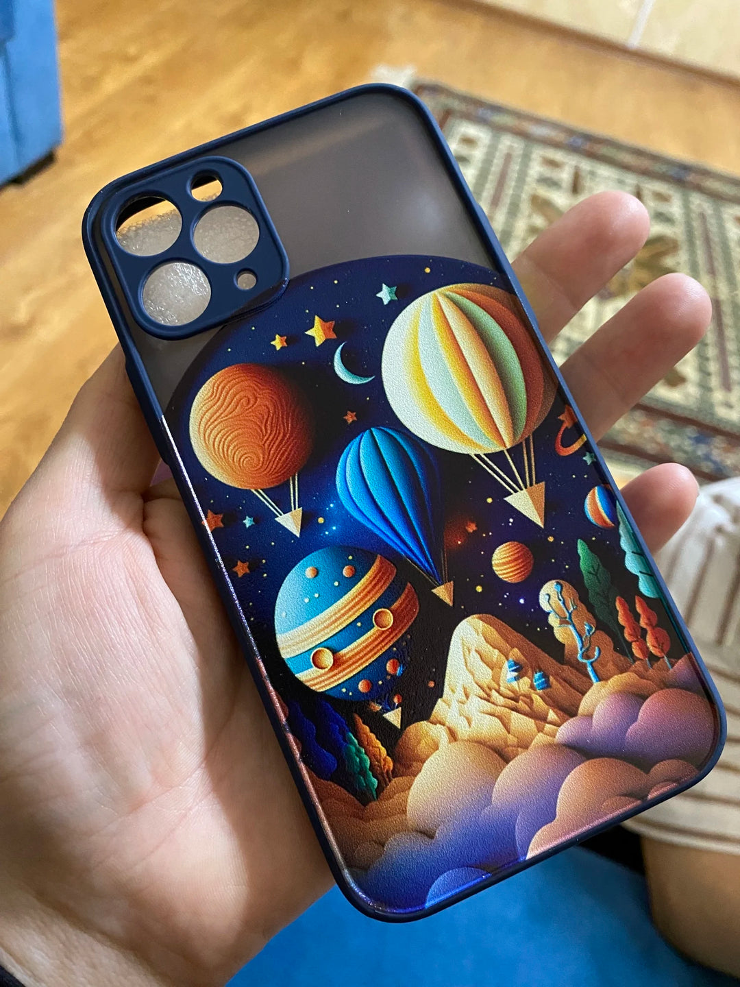 sky themed phone case in hand