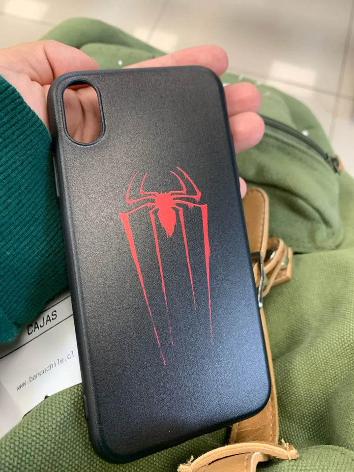 A black phone case with a red and black Spider-Man emblem