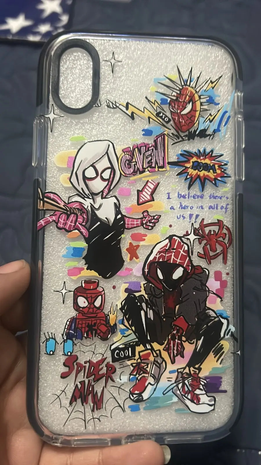 A transparent phone case with a colorful Spider-Verse design