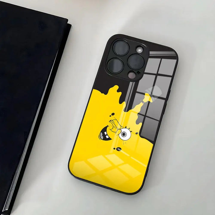 A glass phone case featuring a cartoon-style illustration of SpongeBob SquarePants' face