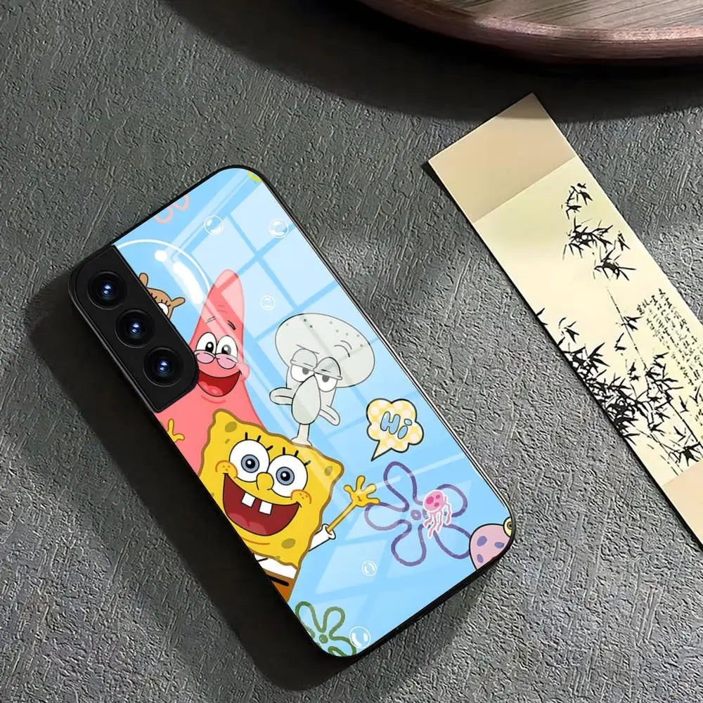 A glass phone case featuring SpongeBob SquarePants, Patrick Star, and Squidward Tentacles standing together on a blue background with bubbles and flowers