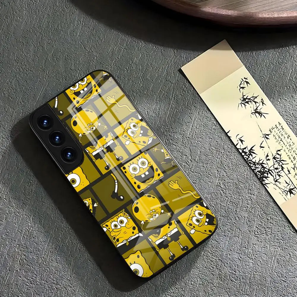 A glass iPhone case featuring a collage of SpongeBob SquarePants in various poses