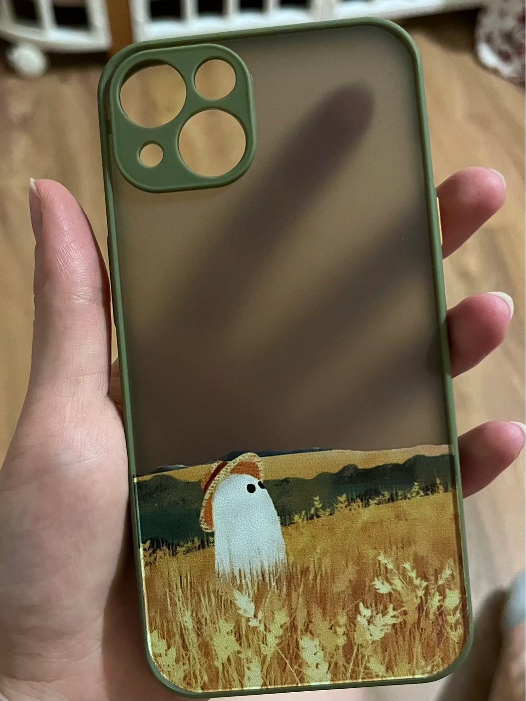 Phone case of cute ghost in bright field