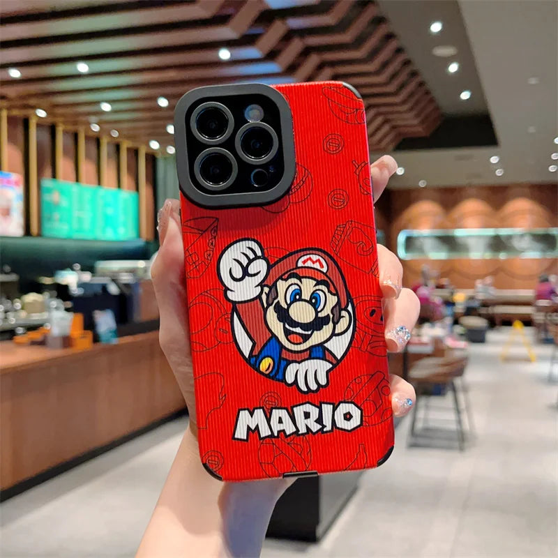 A hand holds an iPhone in a protective, hard plastic case styled with the Super Mario design, from the product line "Super Mario for iPhone," in a coffee shop.