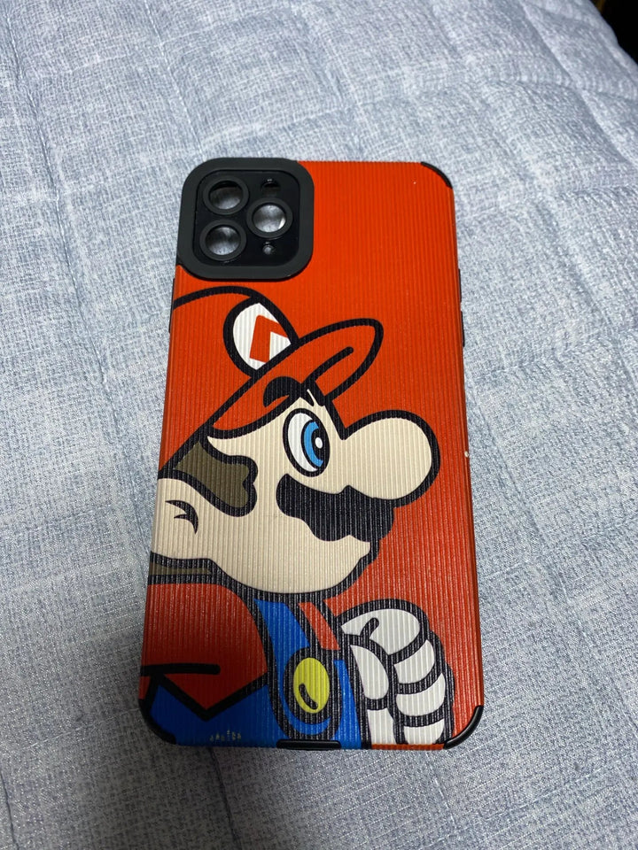 The Super Mario for iPhone is a smartphone encased in a protective, hard plastic red cover adorned with a Super Mario design, highlighting the iconic character in his blue outfit and red hat against a light gray textured background.