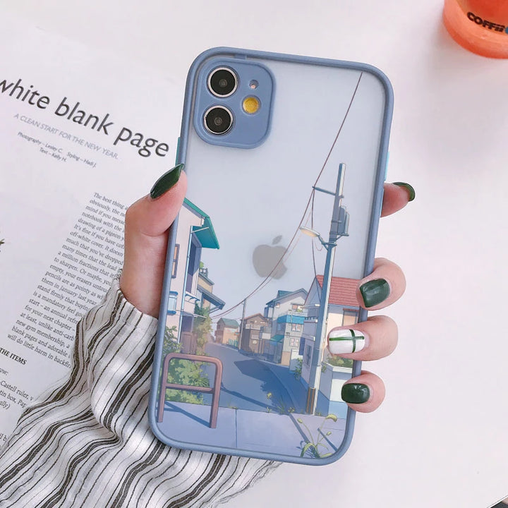 A blue phone case with a frosted back featuring a Japanese cityscape with buildings, power lines, and a street