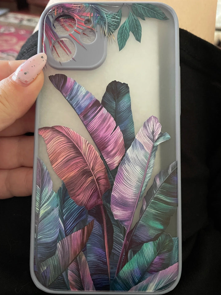 Photo of frosted phone case with a vibrant tropical leaf design