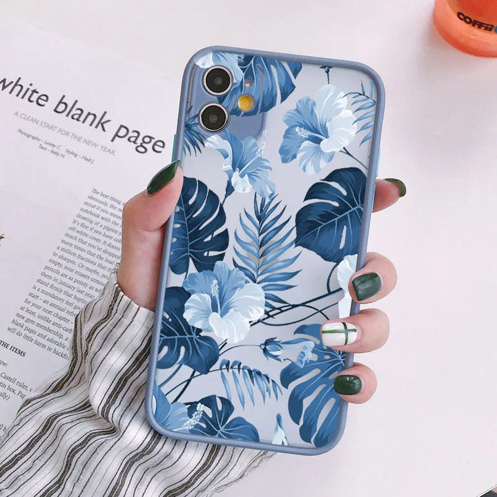 Photo of frosted phone case with a blue floral and tropical leaf design