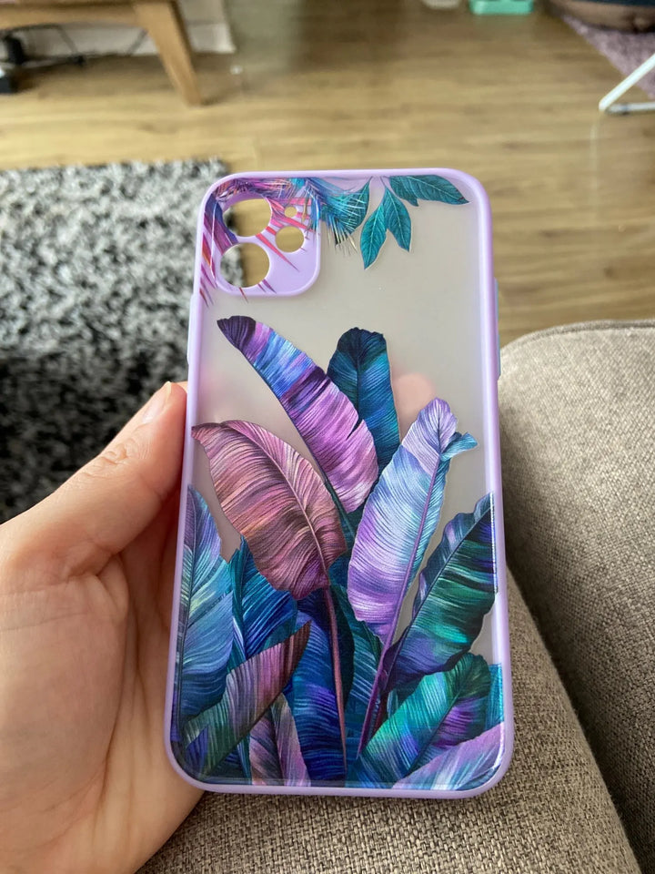 Photo of frosted phone case with a vibrant tropical leaf design