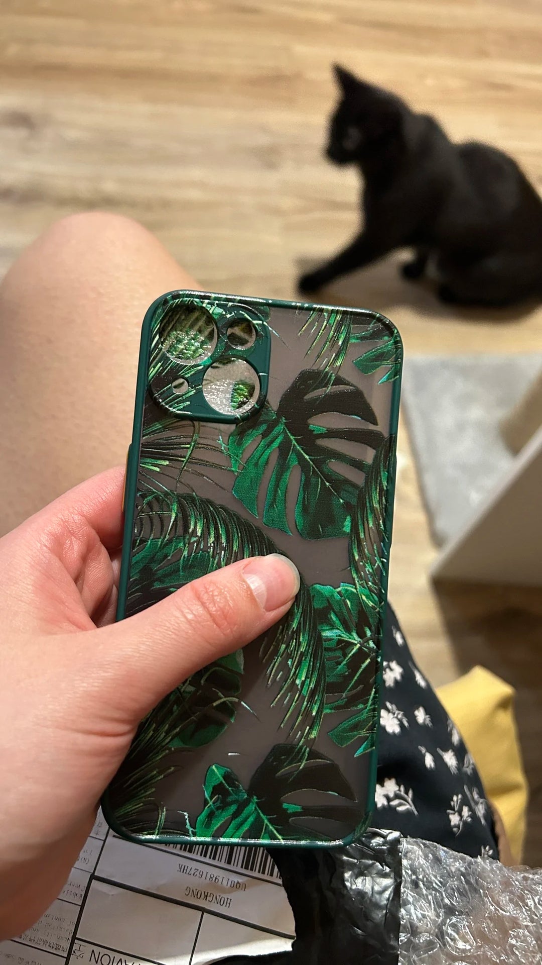 Photo of frosted phone case with a vibrant tropical leaf design