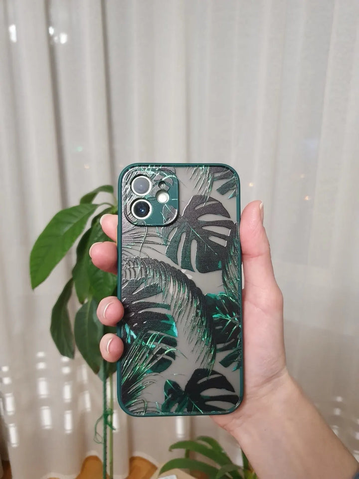 Photo of frosted phone case with a vibrant tropical leaf design