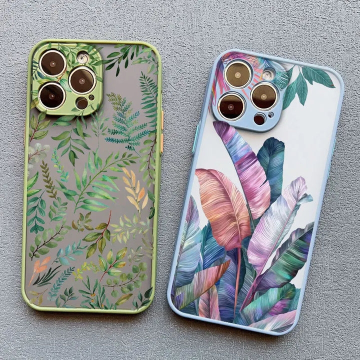 Two phone cases with a vibrant tropical leaf design