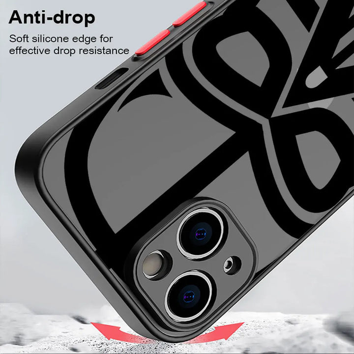 Introducing the Vader Mask for iPhone: a sleek, black smartphone case designed with a dual-camera cutout and striking red side buttons. The image text reads, "Anti-drop. Soft silicone edge for effective drop resistance and anti-scratch protection." Embrace a stylish aesthetic that's reminiscent of Darth Vader's iconic mask.