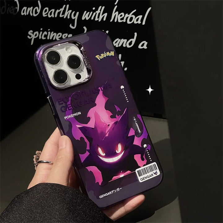 Hand holding a phone with a Vibrant Plating Pokemon Case for iPhone, showcasing a purple Gengar-themed design with bright red eyes and sharp teeth. The case features a black background adorned with text to add extra Pokémon flair. As part of the Pikachu and Gengar phone cases collection, it offers anti-scratch protection to keep your style intact.