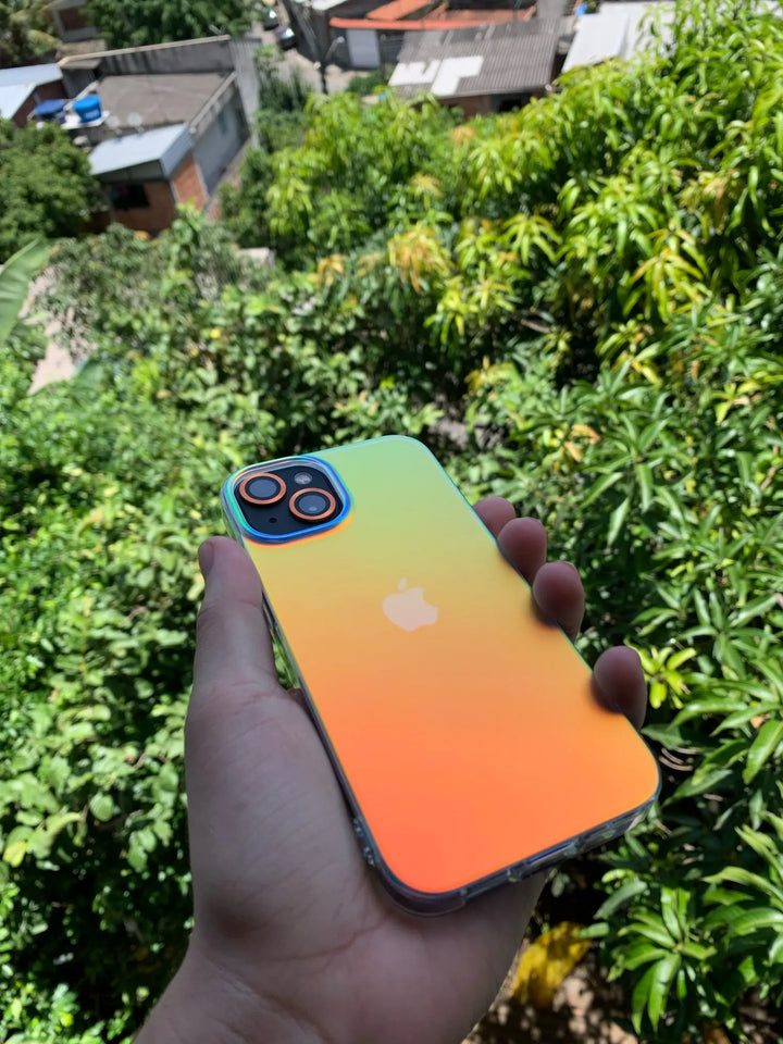 white gradient and matte phone case with orange hue held outdoor