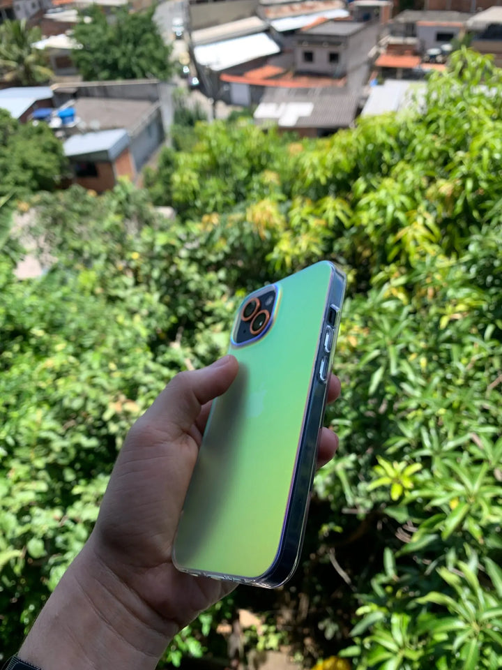 white gradient and matte phone case with green hue held outdoor